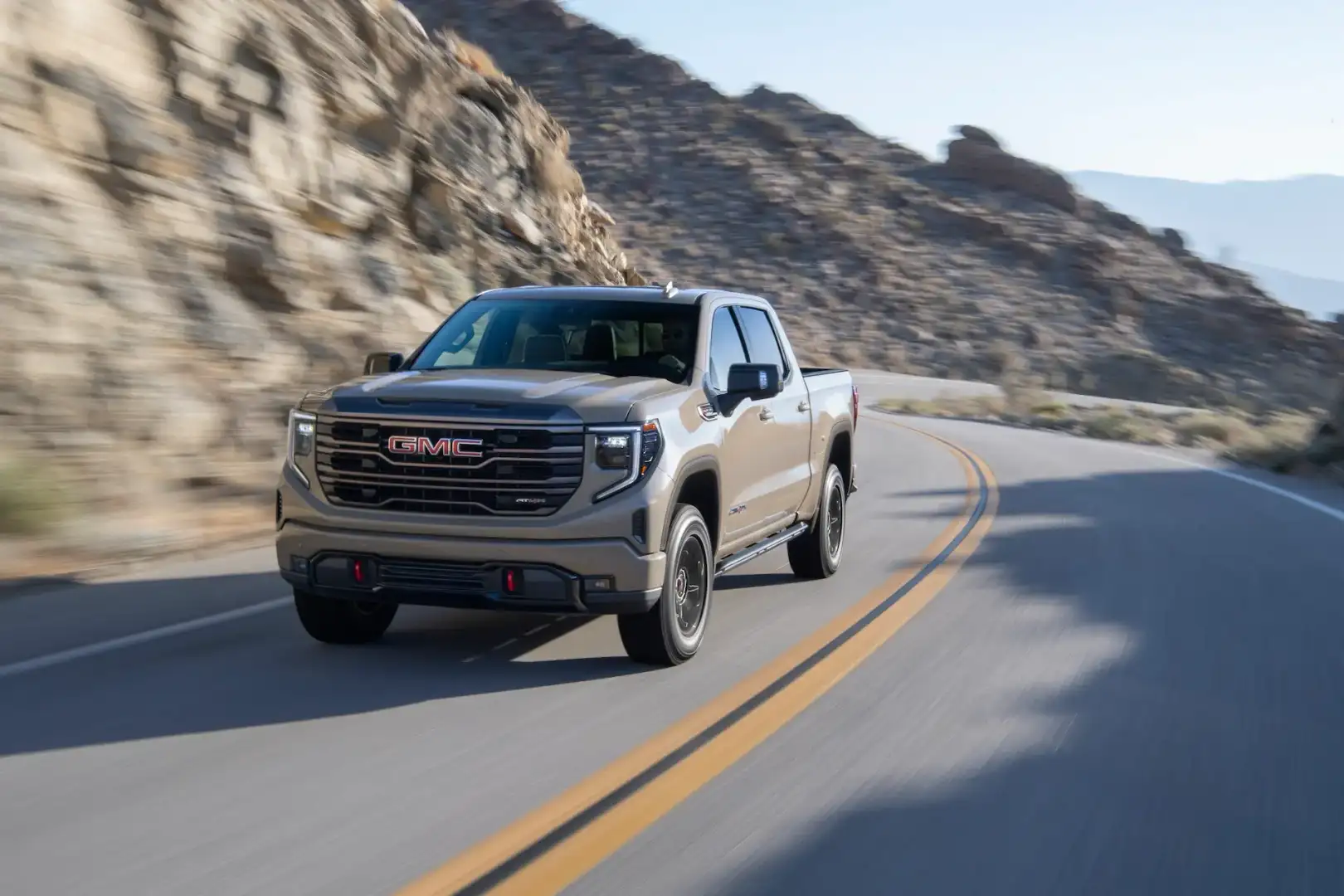GMC Sierra 1500 driving on a mountain road