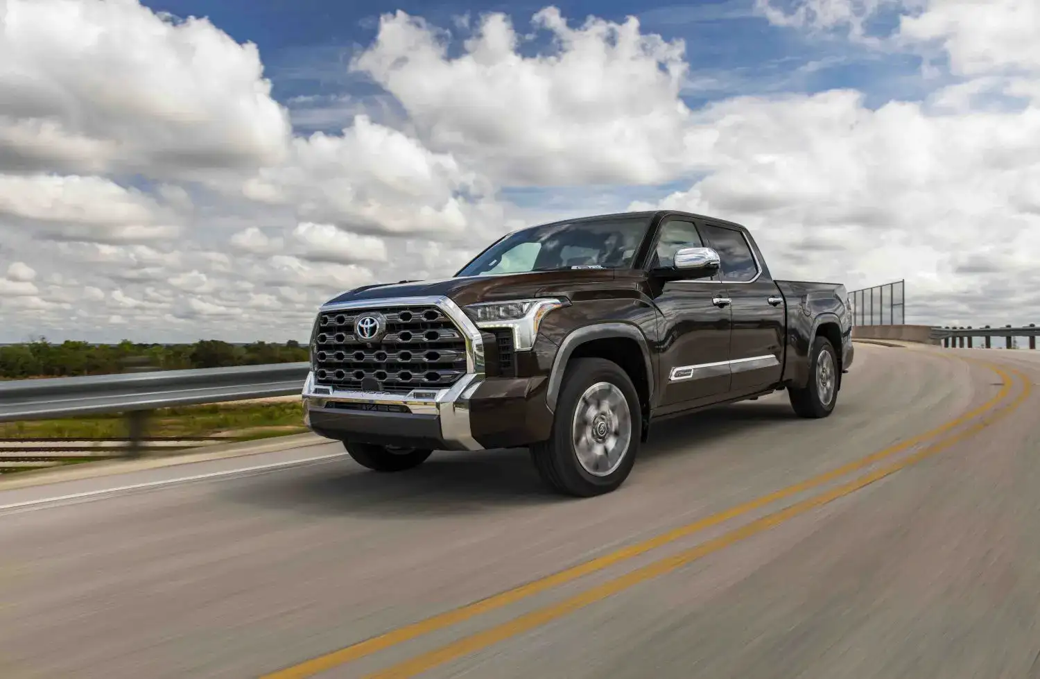 Black Toyota Tundra 1794 edition driving on a country road