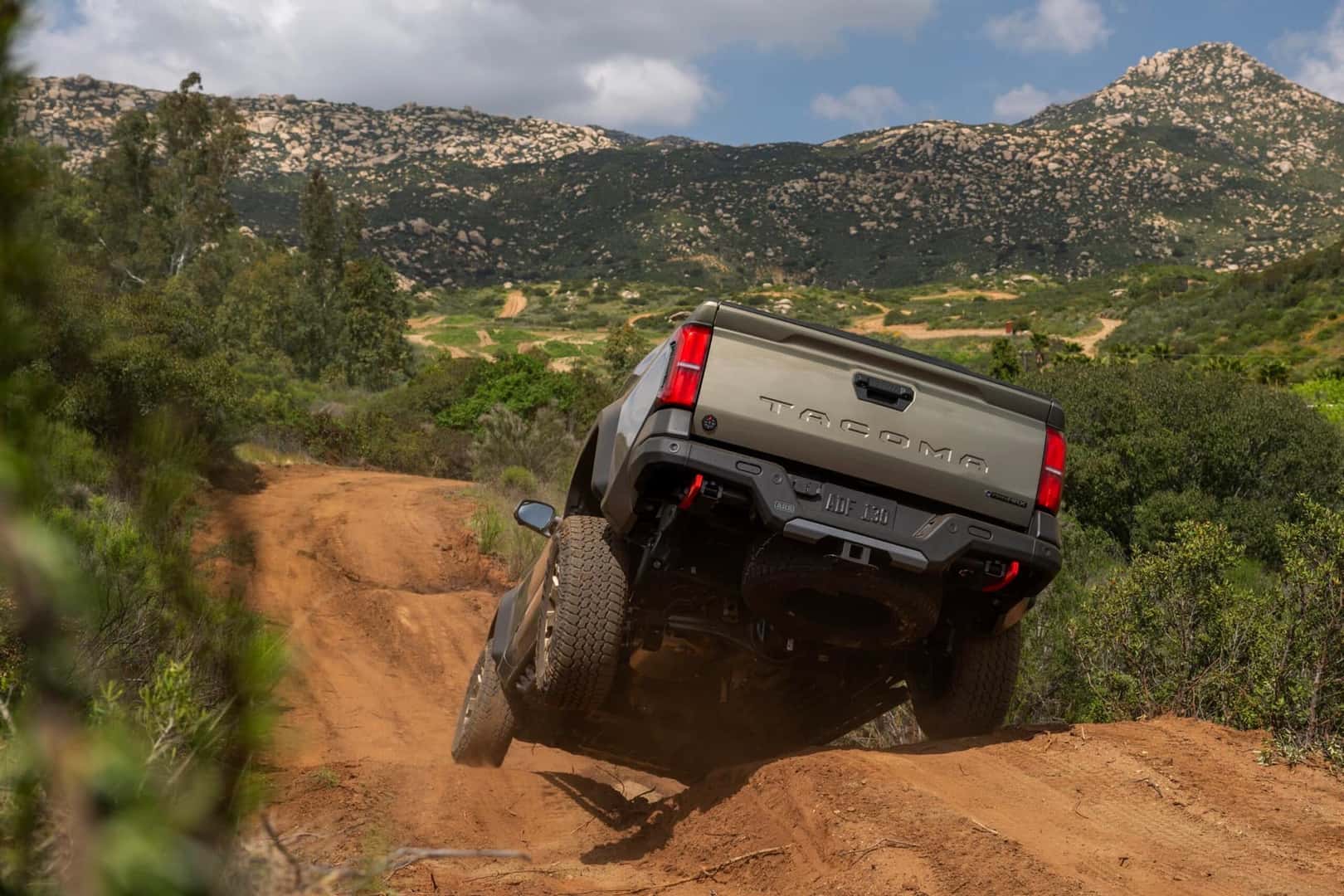 2026 Toyota Tacoma Trailhunter Bronze Oxide jumping hill