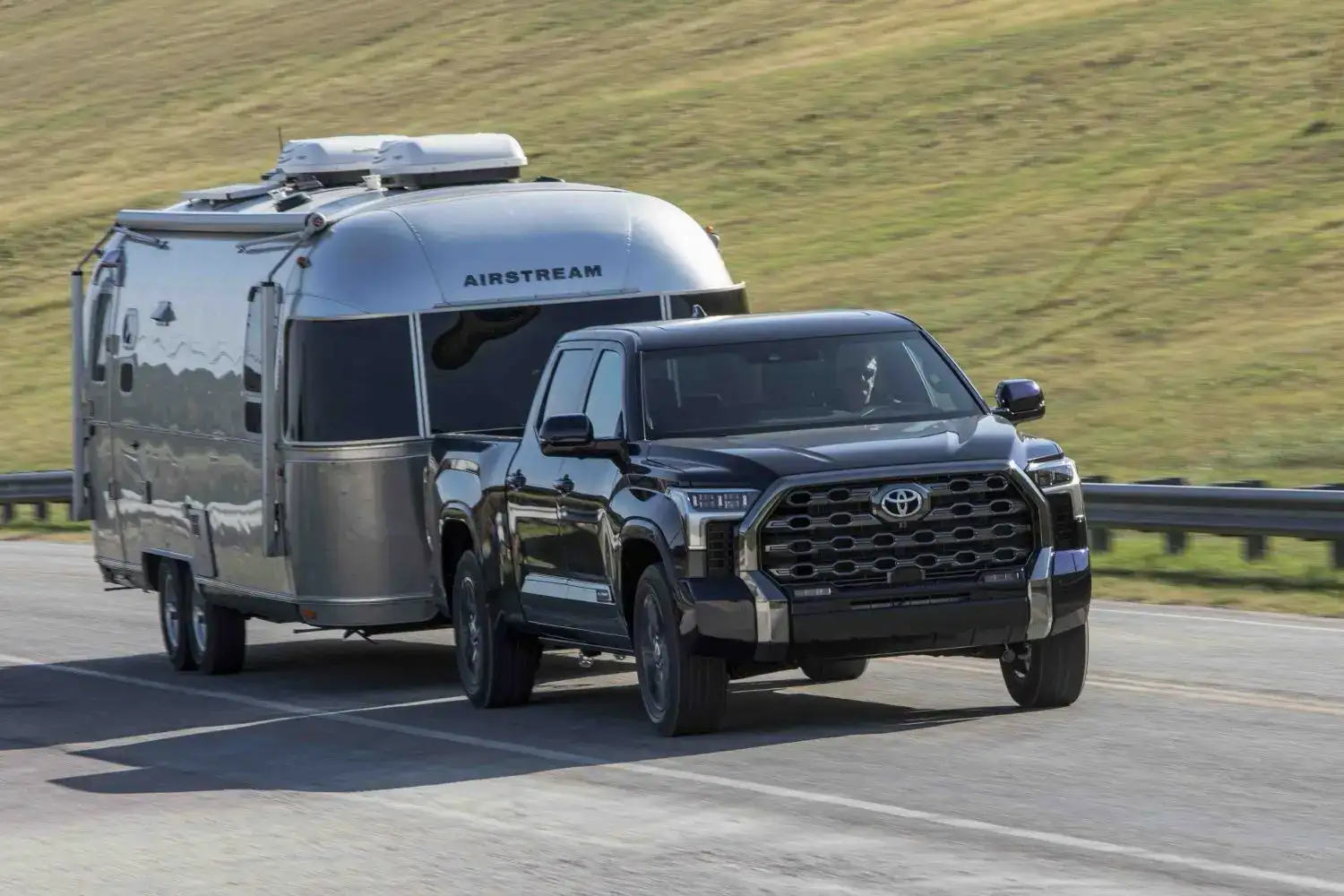 2026 Black Toyota Tundra Platinum towing an RV