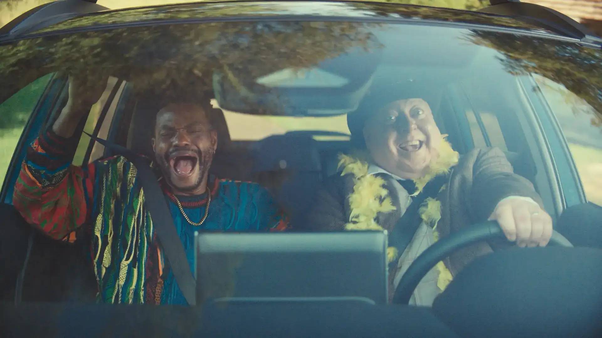 Toyota Corolla Cross Interior view with a driver and a passenger laughing