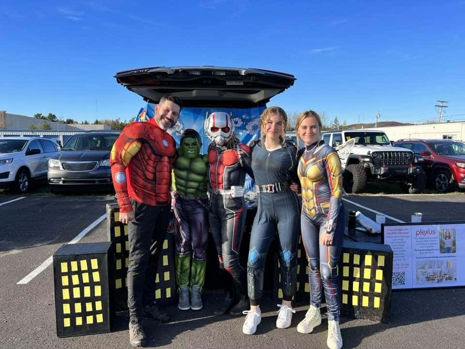 Trunk or Treat event: family next to car