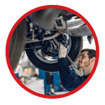 circle-cropped image of a car repair under the car.