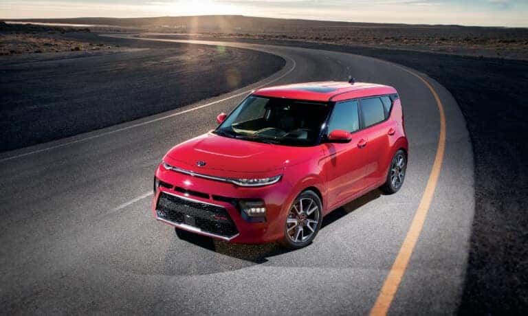 Red 2021 Kia Soul on a country road