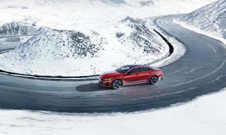 2022 Kia K5 Driving In Snowy Mountains Faraway