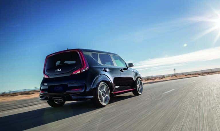 Kia Soul Driving Away Fast On Open Road