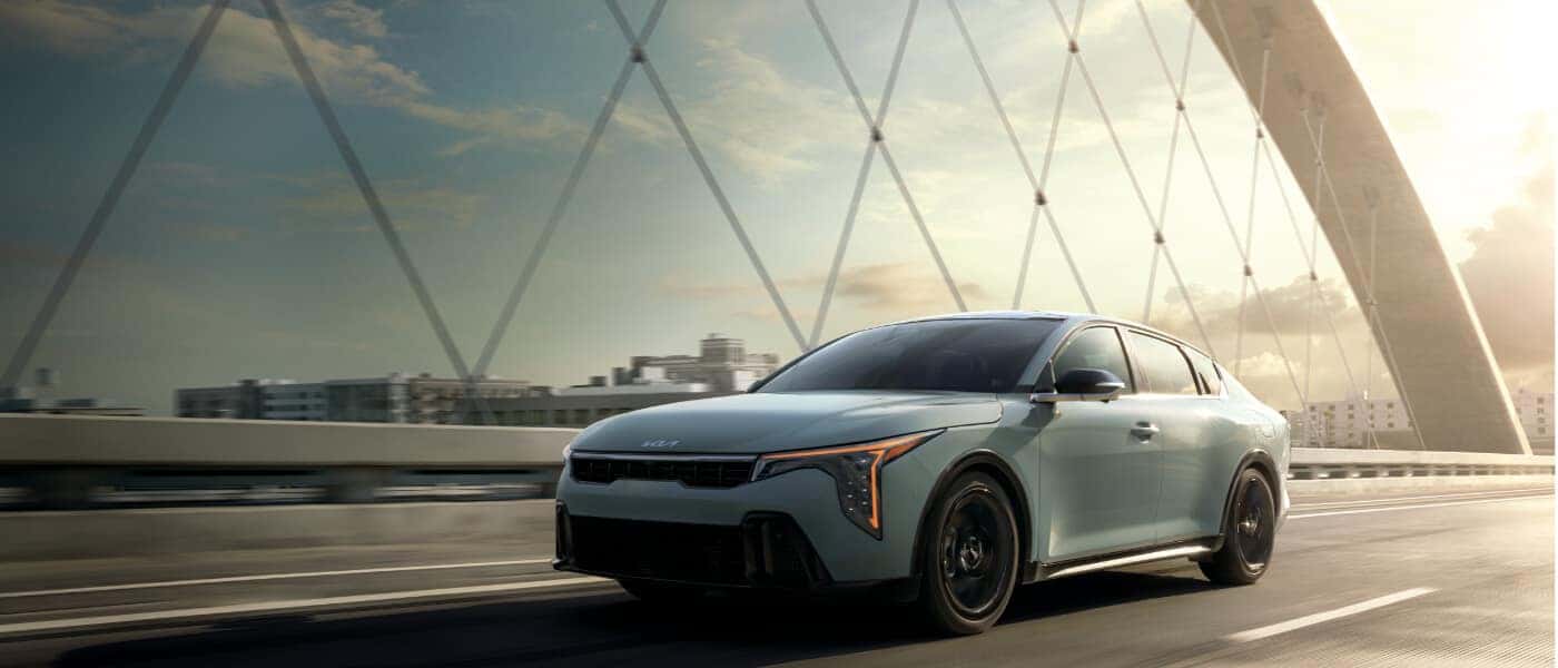2026 Kia K4 Exterior Driving On Bridge
