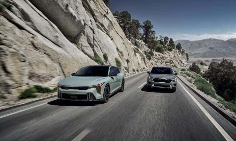 2026 Kia K4 Exterior Two Driving In Mountains