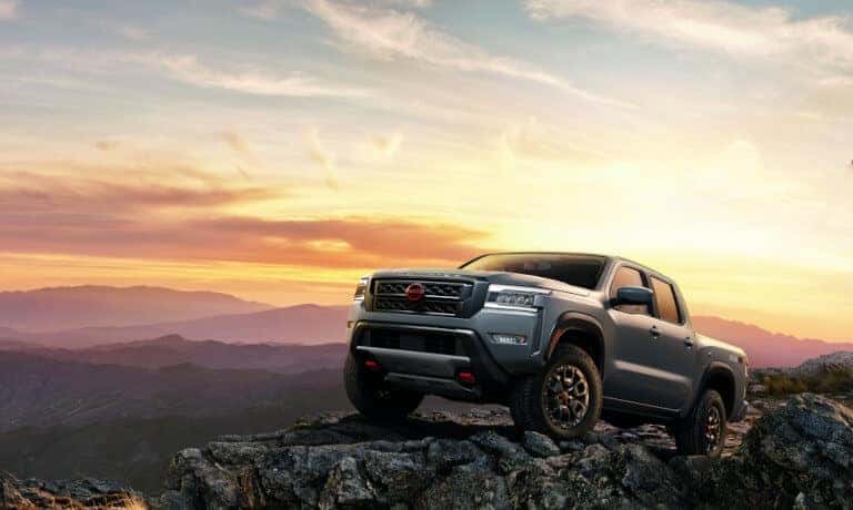 2022 Nissan Frontier Offroad On Mountain With Sunset