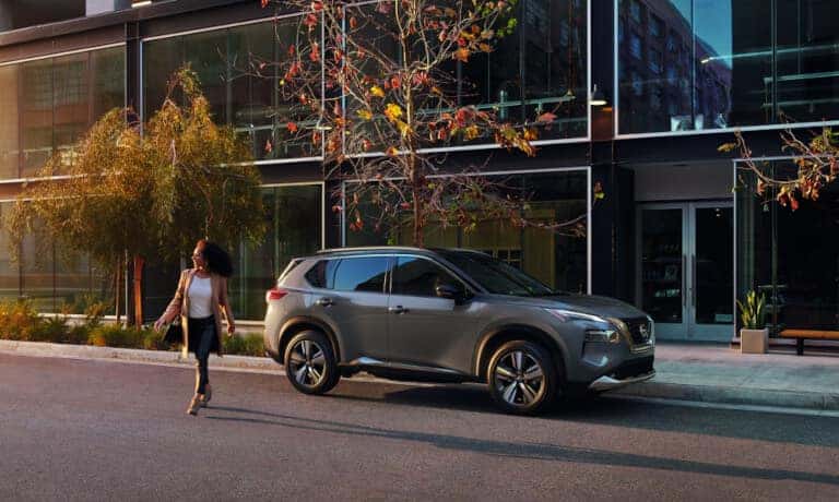 2022 Nissan Rogue Sport Exterior Parked In City With Woman