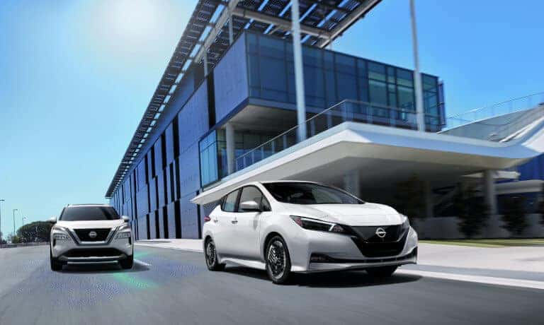 2024 Nissan LEAF Exterior Tow Driving By Office Building