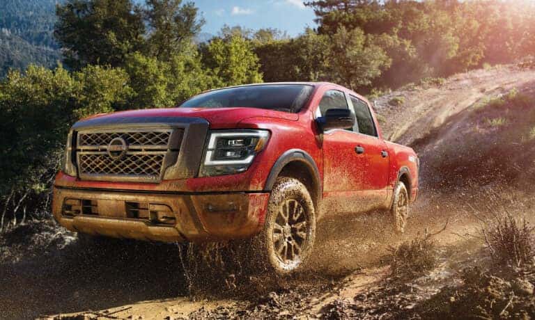 2024 Nissan TITAN Exterior Driving Through Mud