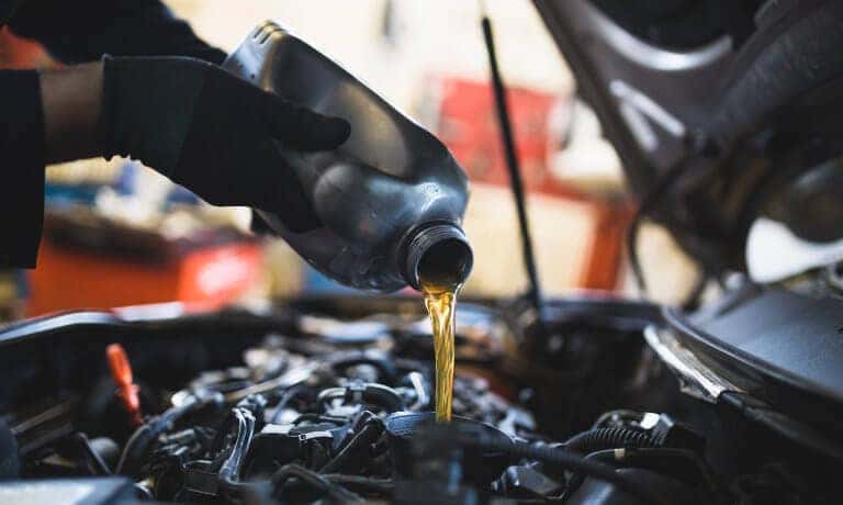 Service Oil Change Pouring Oil Wide