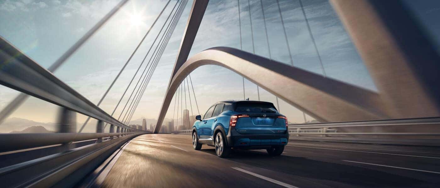 2026 Nissan Kicks Exterior Driving Away On Bridge