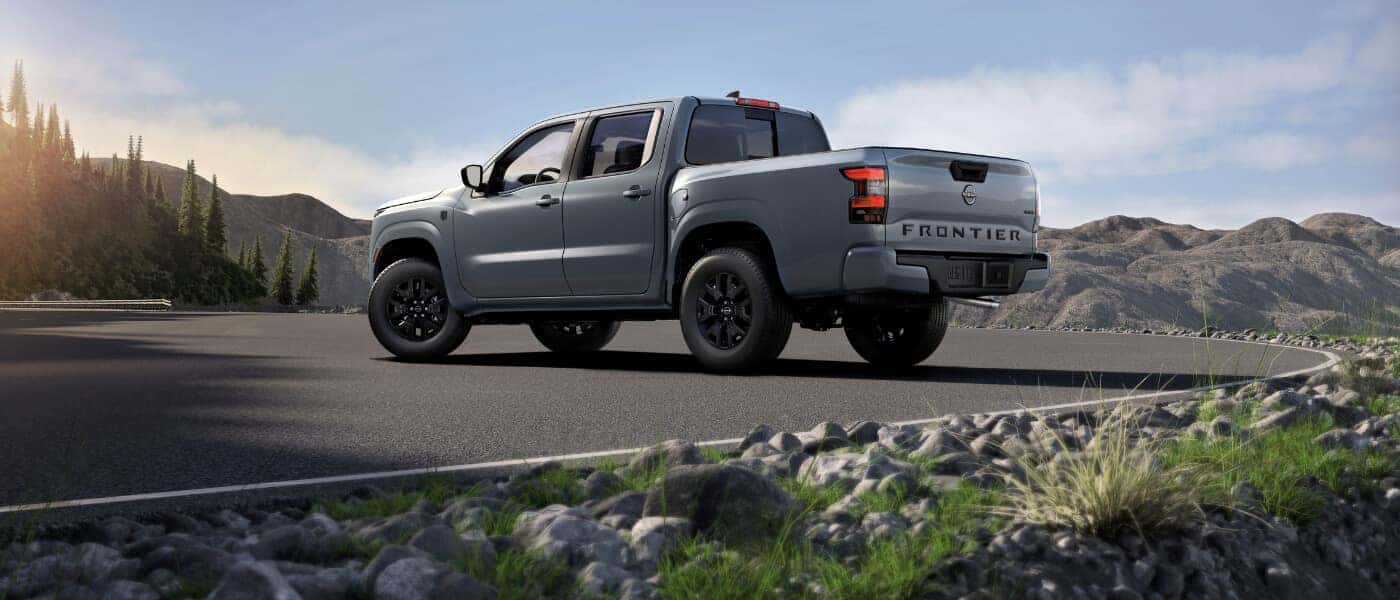 2026 Nissan Frontier rear view in mountains