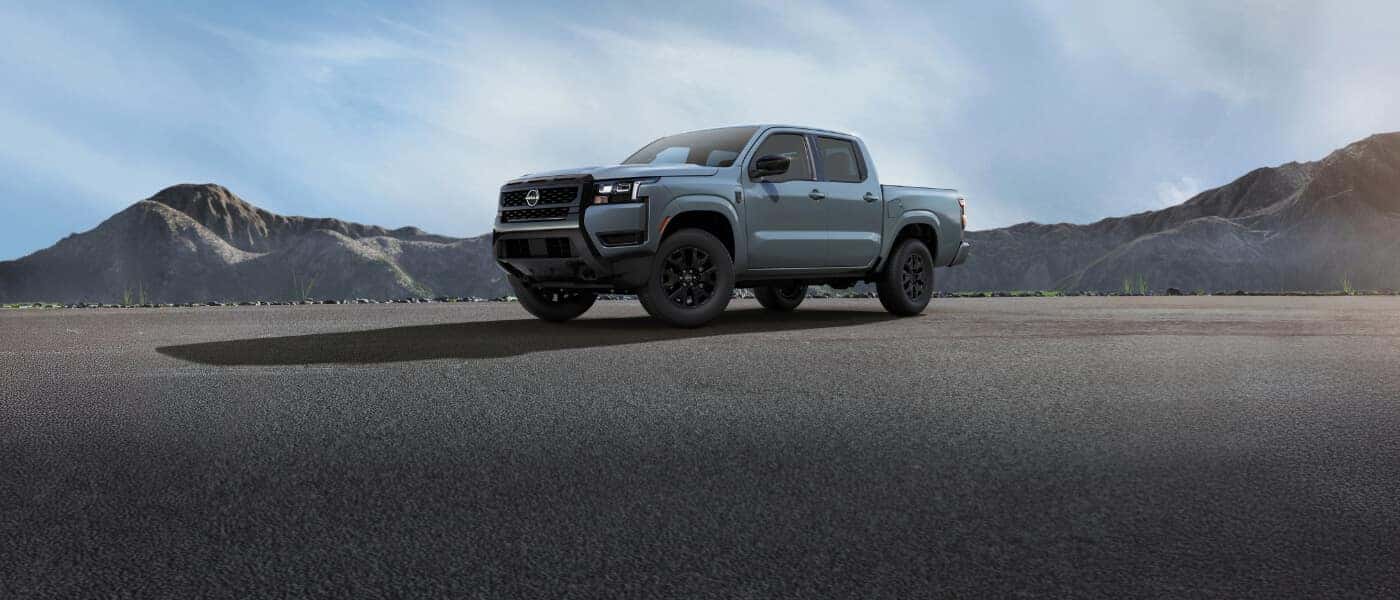 2026 Nissan Frontier side view parked in mountains