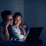 Couple having movie night at home