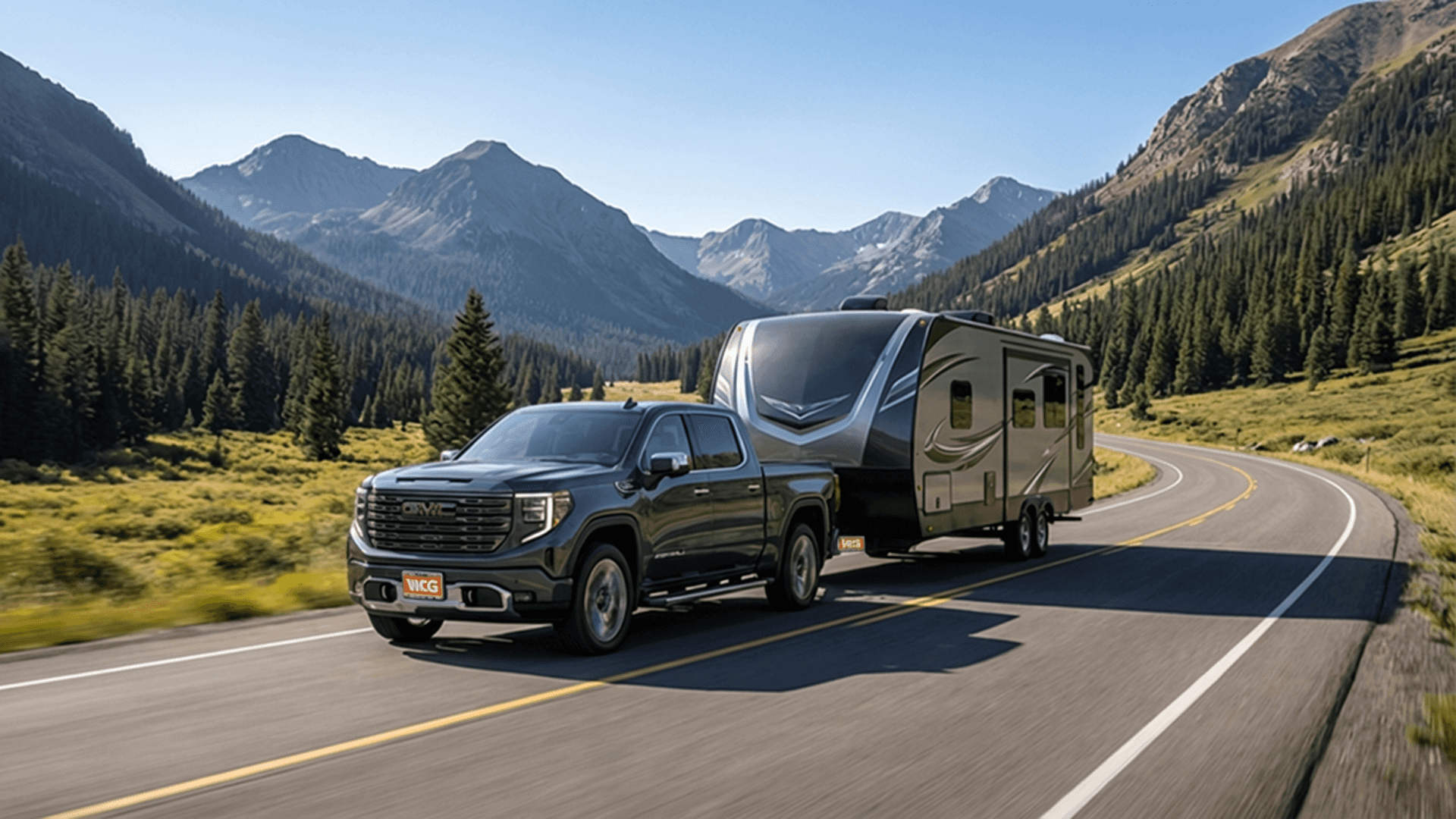 2026 GMC Sierra 1500 towing a camper through Colorado mountain terrain