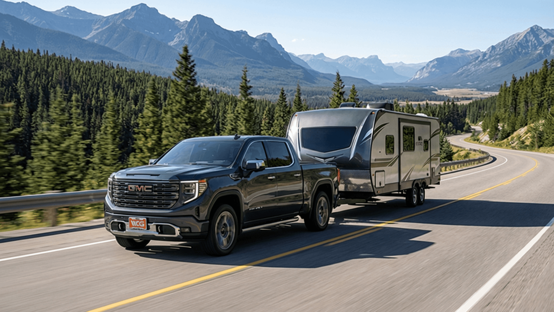 2026 GMC Sierra 1500 towing a camper through Colorado mountain terrain