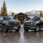 A GMC Sierra 1500 Denali Ultimate next to a Ford F150 Platinum in the Colorado Mountains