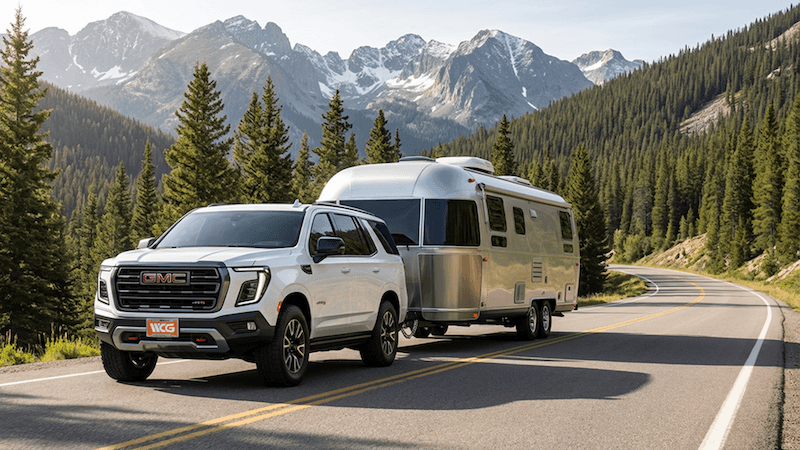 2026 GMC Yukon towing horse trailer in Colorado mountains