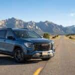 2026 GMC Terrain on a Northern Colorado highway with Rocky Mountains in background