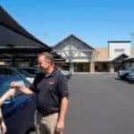 A first-time buyer getting keys to their used car.