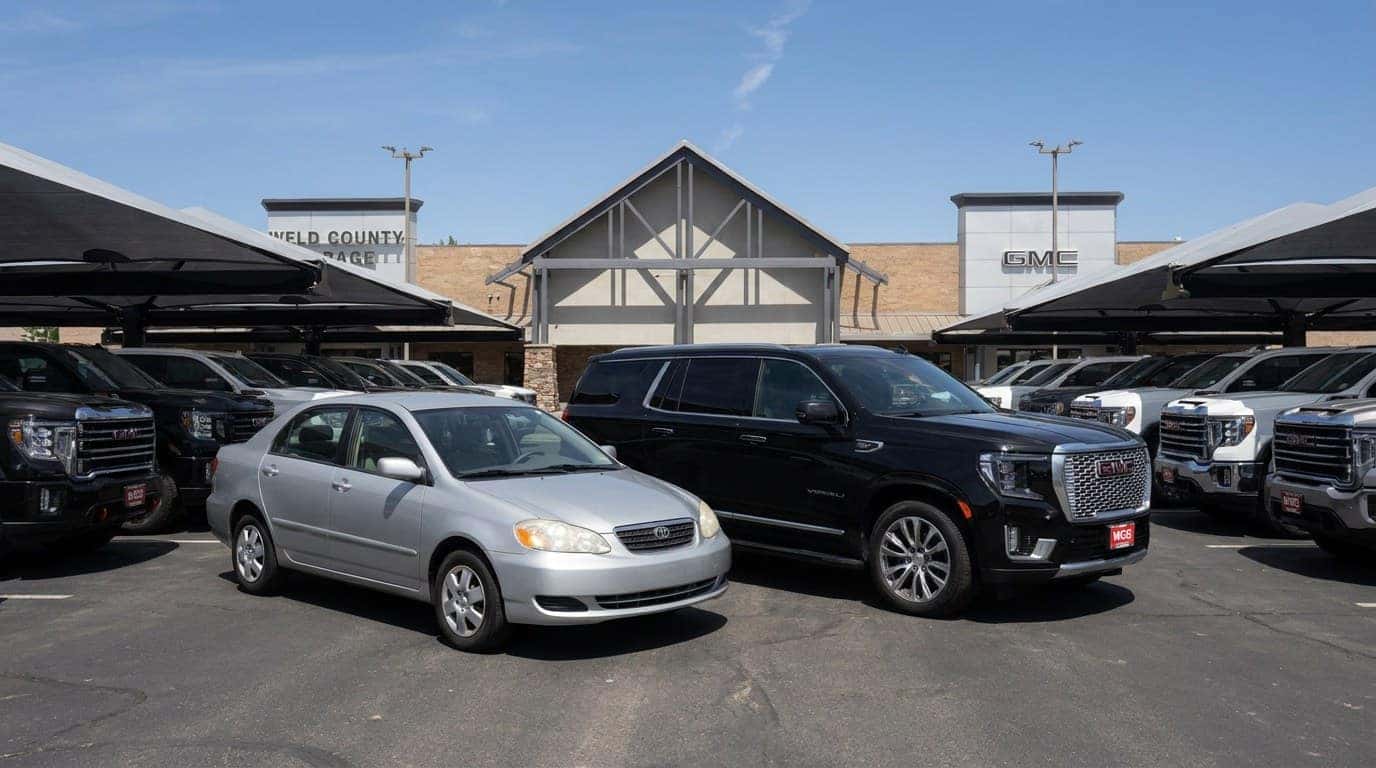 Affordable used cars and premium SUVs parked together at Weld County Garage Greeley