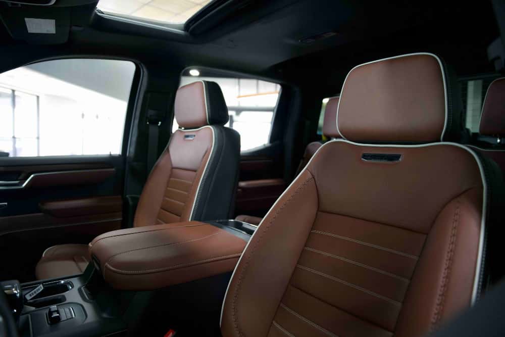 Alpine Umber Nappa leather front seats inside the 2026 GMC Sierra 1500 Denali Ultimate at Weld County Garage GMC