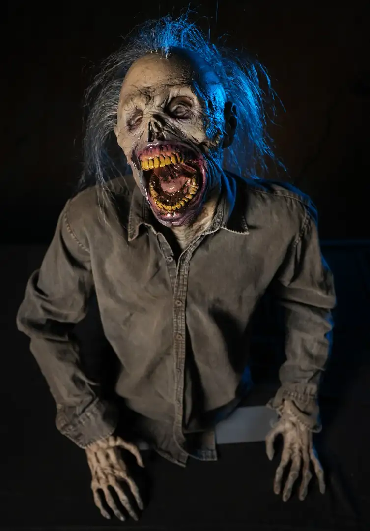 Death Rising zombie animatronic prop by Distortions Unlimited, the Monster Day giveaway prize at the Weld County Garage GMC booth